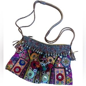 Banjara Leather Strap and Tassels Crossbody, embroidery mirror tassel details